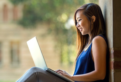 Asian student - sitting on bench- cropped for email-1