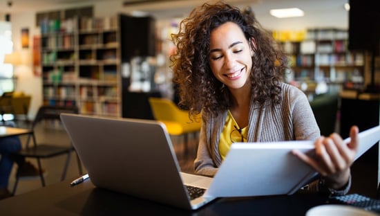 college-student-in-library-with-computer