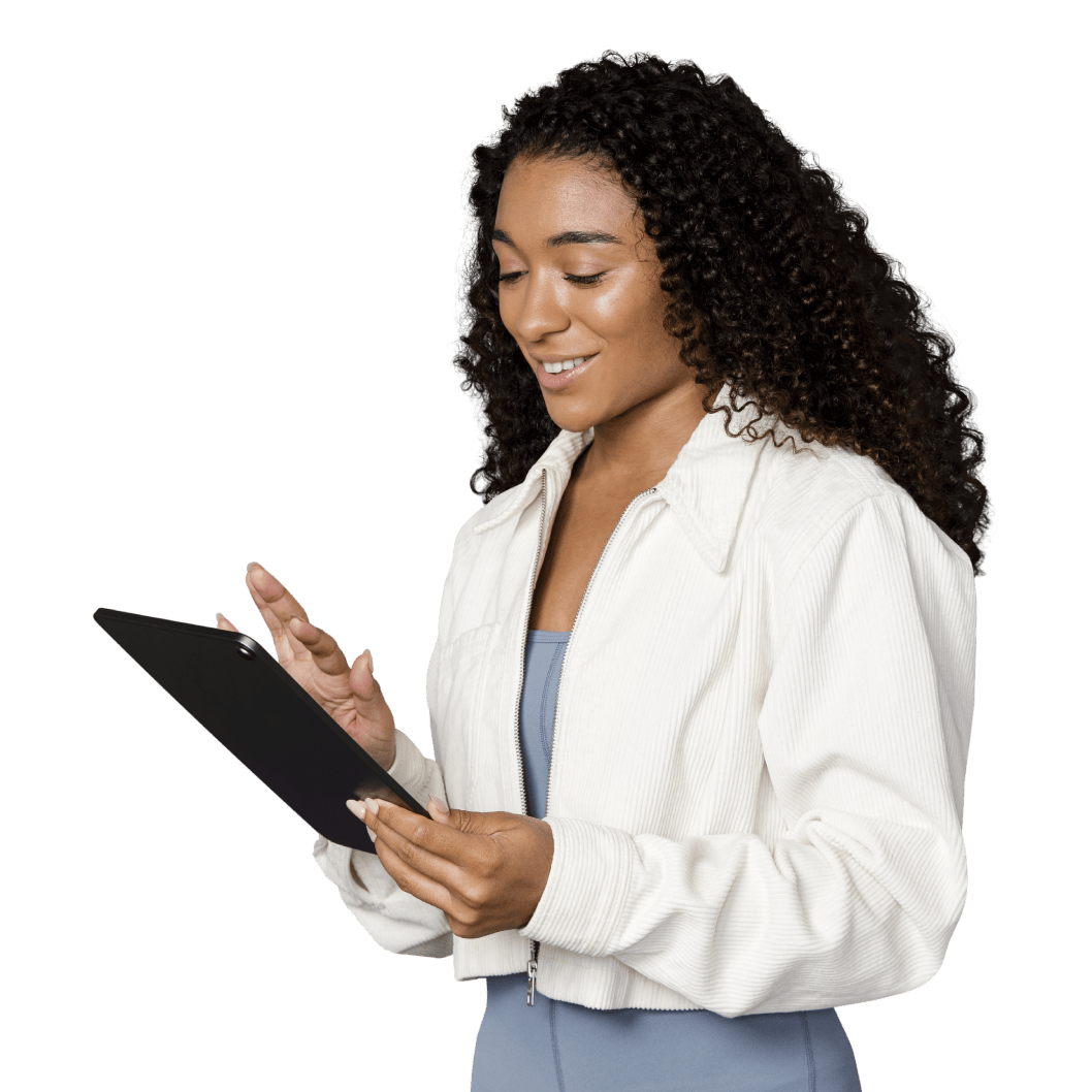woman in white jacket holding a tablet