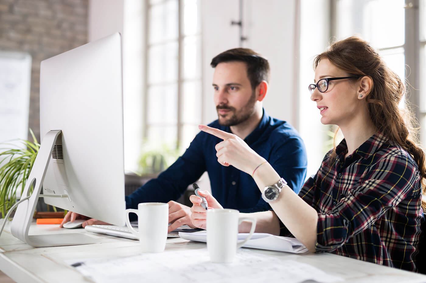 Co-workers reviewing content